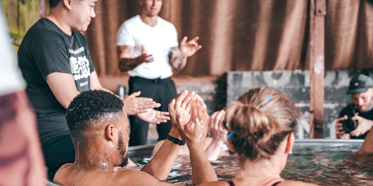 image of a group of attendees in an ice bath part of a mindfulness workshop